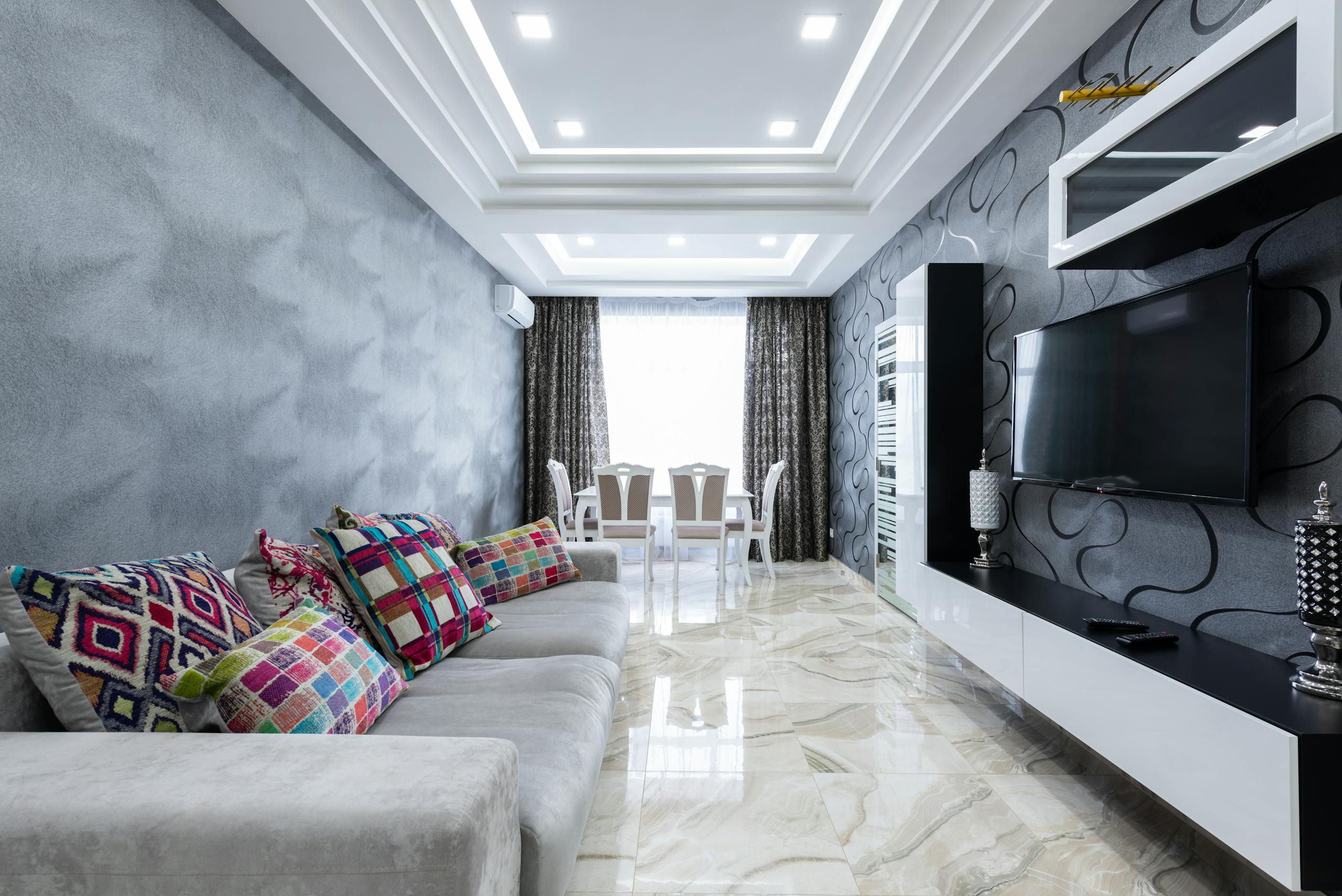 Bright, spacious living room with modern design, luxurious decor, and elegant furniture.