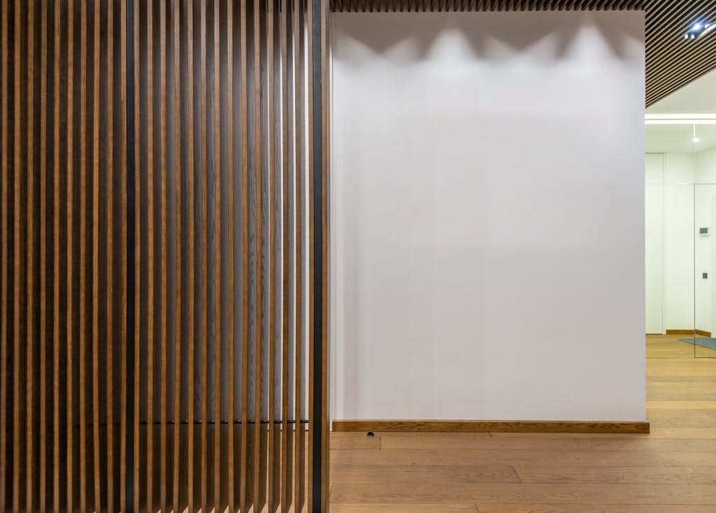 Minimalist indoor space with wooden panels and modern decor, showcasing clean lines and contemporary design.