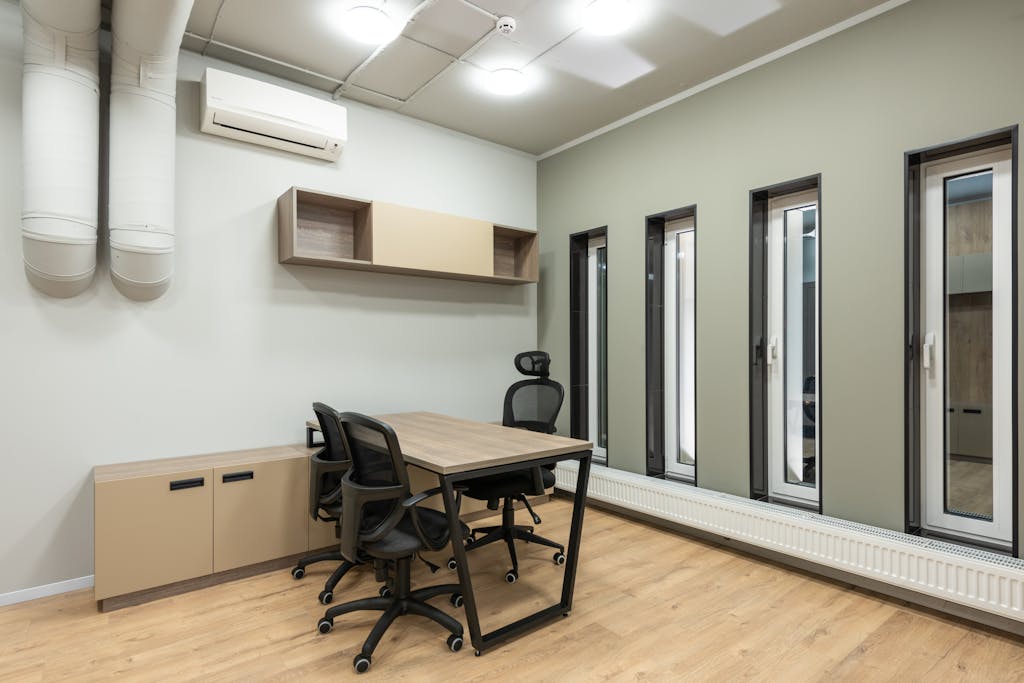 Spacious and contemporary office space featuring minimalist design and ample natural light.